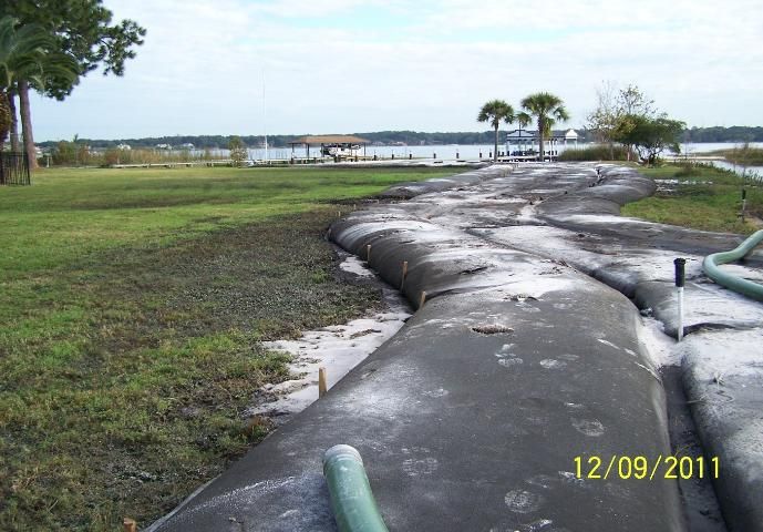Figure 8. Large-scale muck removal using geofilter tube to dewater muck from Lake Down, FL.