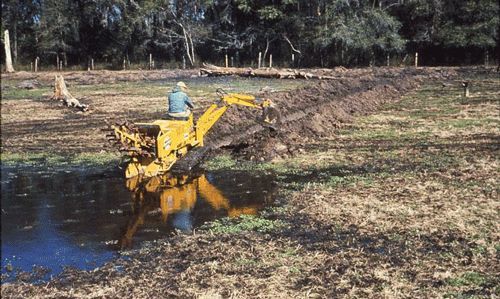Figure 11. Digging drainage canals to remove standing water is one method to reduce mosquito larval developmental opportunities.