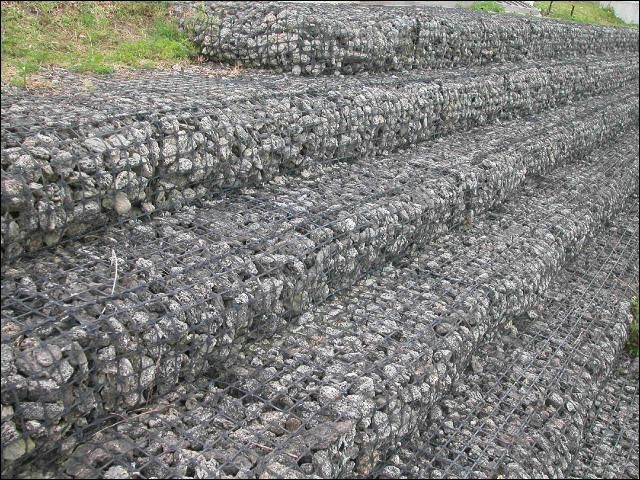 Figure 6. Use of gabions for stabilization of a canal side-bank. While expensive, these materials effectively prevent erosion in canal/ditch areas subject to high flow velocities.