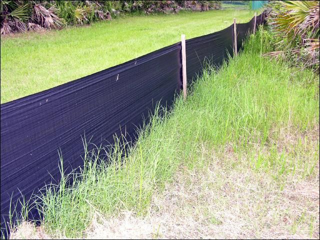 Figure 7. Snake fences, such as this one made of silt fencing, can prevent some snakes from entering your yard when used correctly, but can be costly and time consuming to install and do not prevent all species of snakes from entering. Such measures should only be used as a last resort.