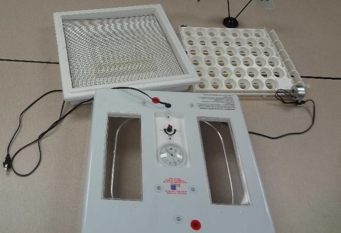 Figure 3. A still air incubator and an automatic egg turner.