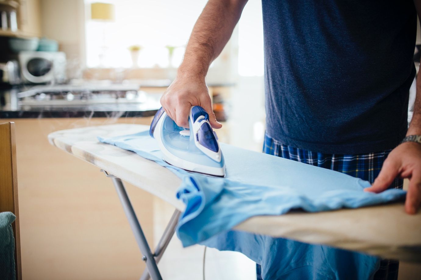 Ironing a shirt.
