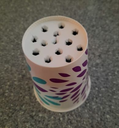 Image 24 cup with holes poked in bottom