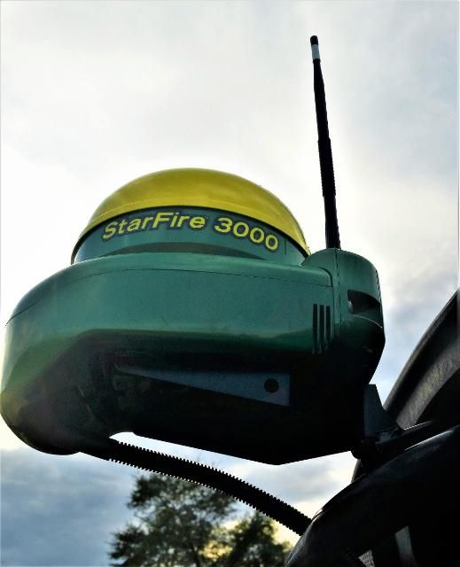 Figure 10. StarFire™ 3000 GNSS receiver and antenna mounted near the top of the cab of a John Deere 9770 STS.