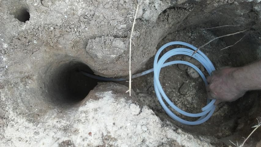 Excavate a void adjacent to the lysimeter cavity to store the leachate sampling tube and tube housing.