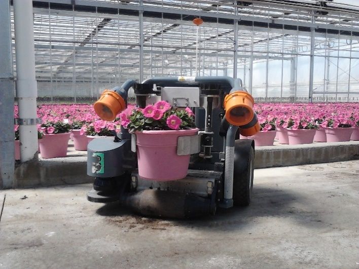 A snapshot of HV-100 Robot for spacing (square or hex pattern) and collection of potted plants for labor-saving, increased plant health, and energy efficiency. 