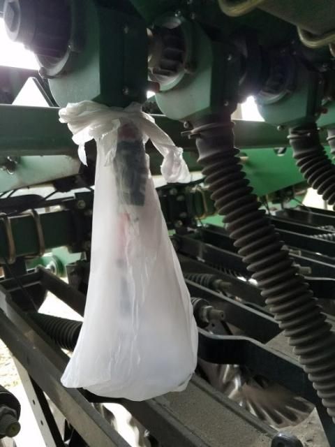 Figure 1. Remove the corrugated tube and attach a bag below the drive gear to collect the seeds.