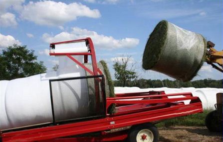 Round-bales of silage wrapped in an “in-line” tube.