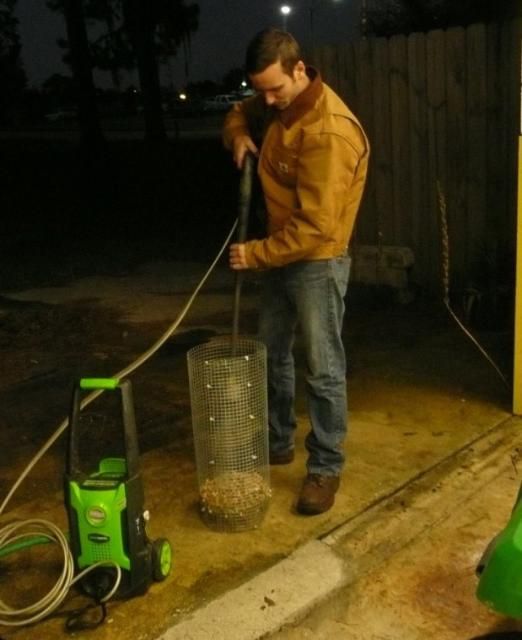Figure 9. Removal of peanut exocarp using water with an electric pressure washer.