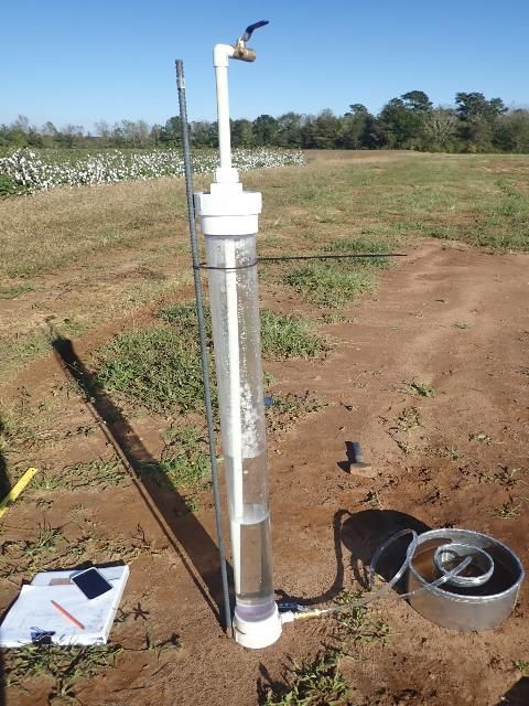 Mariotte siphon zip-tied onto a stand to produce constant head in a double ring infiltrometer to give accurate measurement of infiltration. The bottom of the air tube determines the height of the water column in the inner ring.