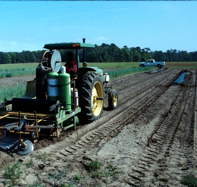 Figure 3. A combination mulch applicator that fumigates, presses the bed, and applies drip tape and plastic mulch in one pass.