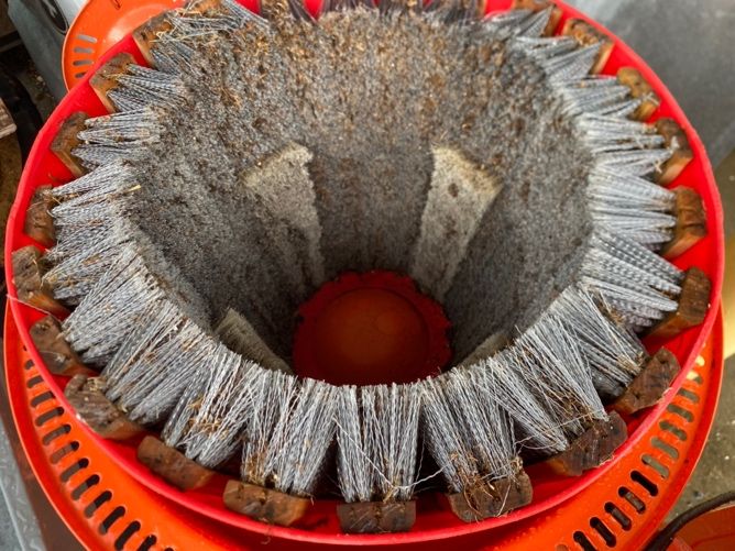 The vertically placed brushes have little space between each other as they ring around the inside of the plastic tub.