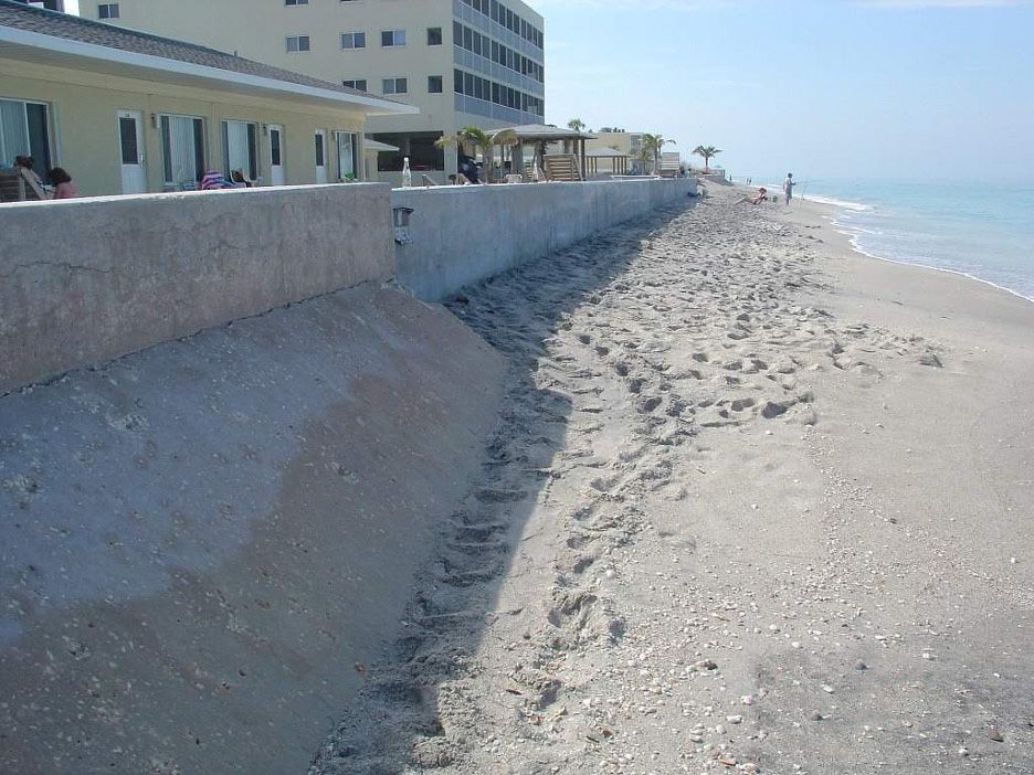 Example of a concrete sea wall where a sea turtle crawled parallel to the wall unable to nest.