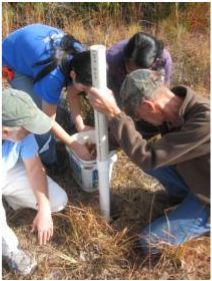 Figure 1. Citizen scientist volunteers assist in the installation of groundwater monitoring wells.
