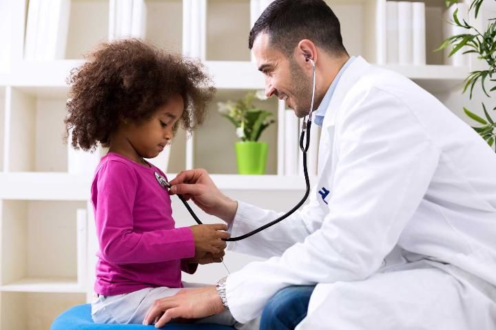 Figure 2. A doctor examining a child.