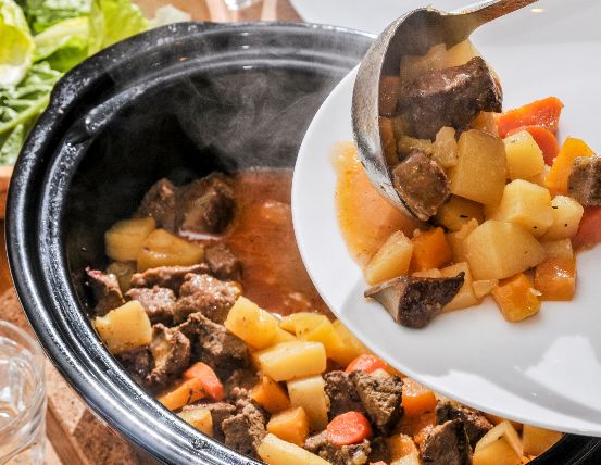 Image of a slow cooker with stew. 