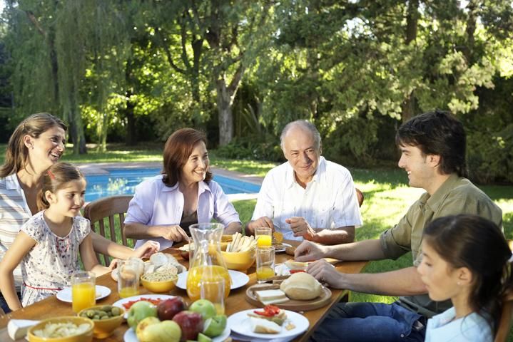 Figure 1. Busy schedules may keep many families from eating regular meals together, but they will benefit from coming together and sharing meals regularly.