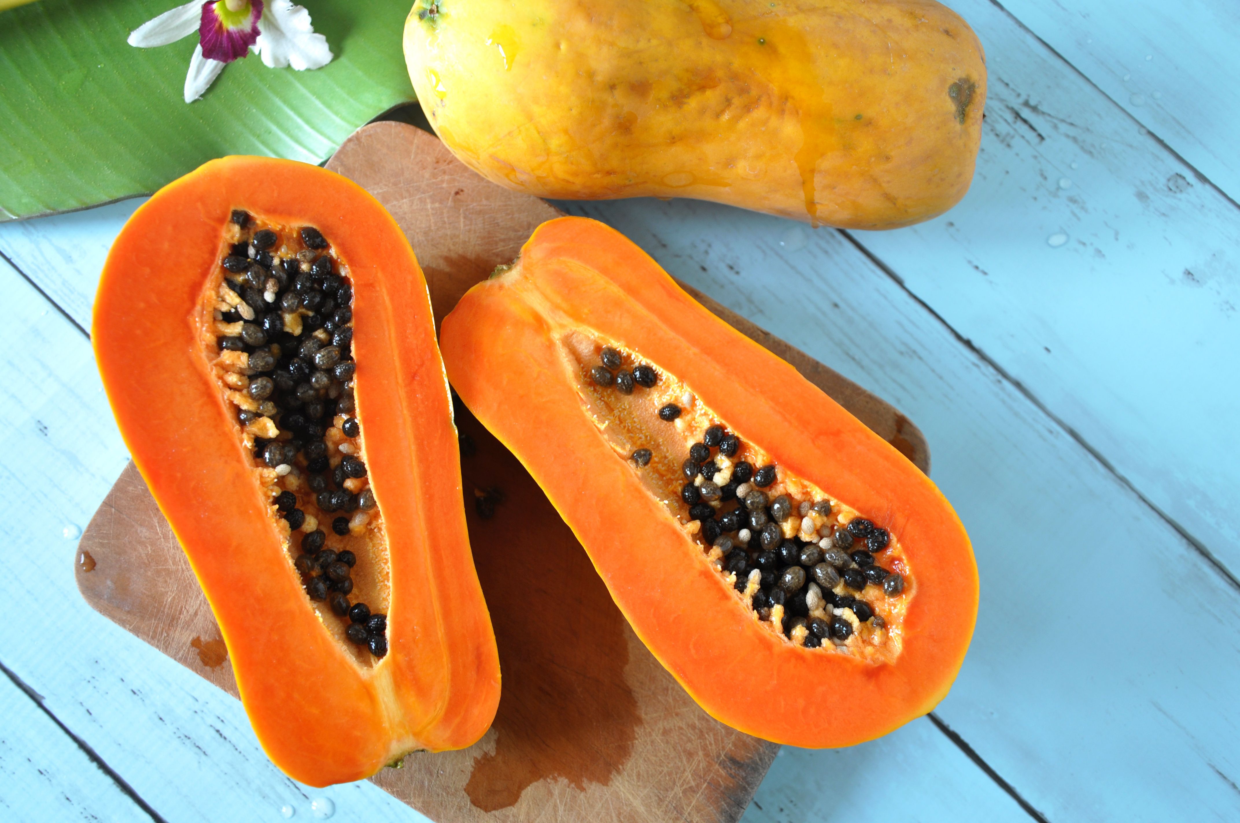 Sliced papaya on a cutting board