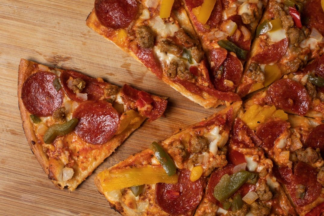 This pizza is likely very high in sodium due to the toppings of sausage, pepperoni, and cheese. The tomato sauce and bread may be contributing substantial sodium as well, depending on the recipe.