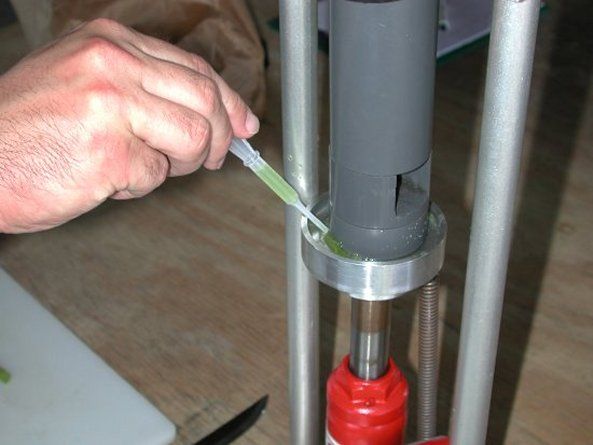 Figure 2. Sap testing for vegetables involves separating the petiole from the leaf blade, (2.1) calibrating the nitrate (NO3-N) and potassium (K) ion specific electrodes (Cardi meter shown here) with standard solutions, (2.2) extracting the sap, (2.3) collecting the sap from the press, and (2.4) placing a droplet of sap on the electrode. A hydraulic press may be needed only when few petioles are available or when petioles contain little sap as may occur with strawberry. In most cases, a garlic press will be an adequate tool to extract the sap. Readings should be compared to published sufficiency ranges.