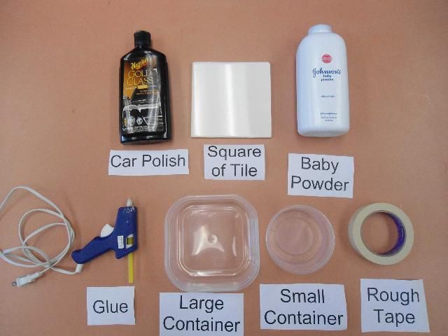 Figure 1. Items needed to make a single bed bug interceptor trap. From left to right and top to bottom: Car polish, square tile, baby powder, glue, large container, small container, rough-surfaced tape.