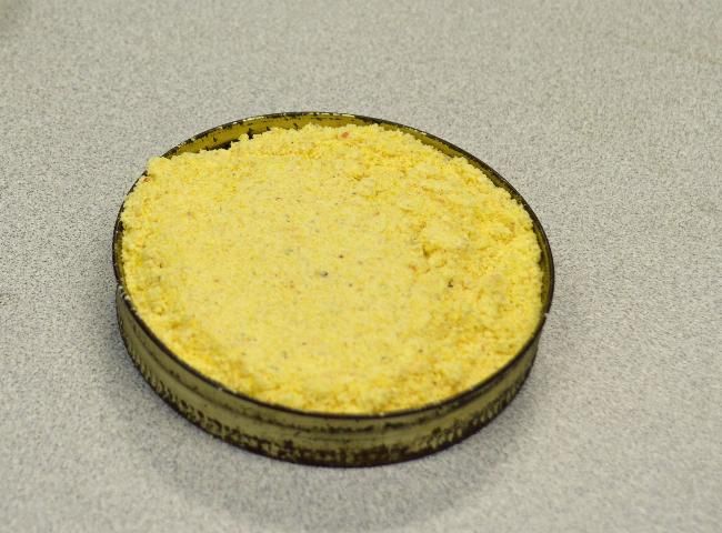 Figure 7. Shallow lid containing corn meal and boric acid for pantry pests.