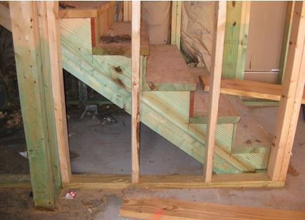Figure 40. The dye marker shows that some wooden elements were treated, but the wall framing unit has likely been added since the treatment and is vulnerable to termites.