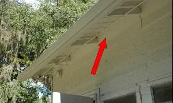 Under eave of house.