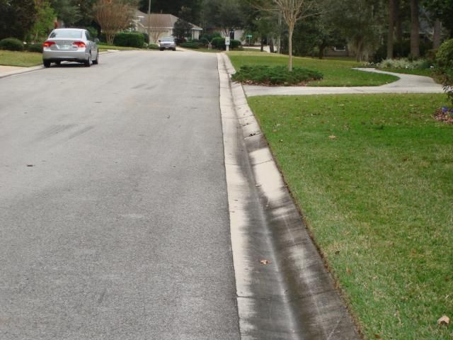 Figure 2. A discoloration of the roadway gutter is a sign of continual wetting from lawn runoff.