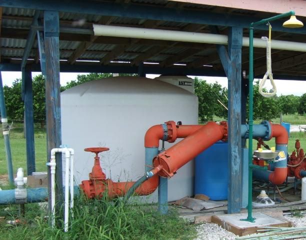 Figure 2. Nutrient solution sources for fertigation are stored in large plastic tanks at the irrigation pump station.