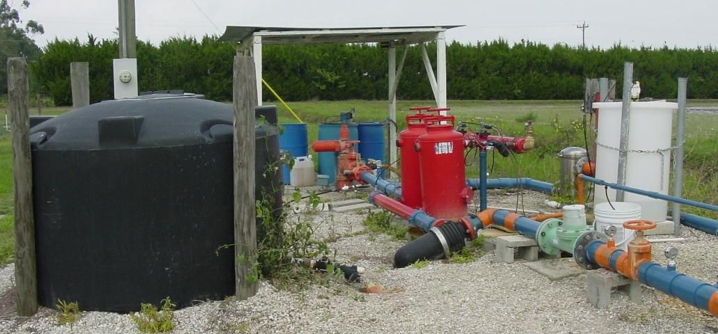 Figure 2. Fertigation equipment, including fertilizer tank (left), filters (center), and injector (right).
