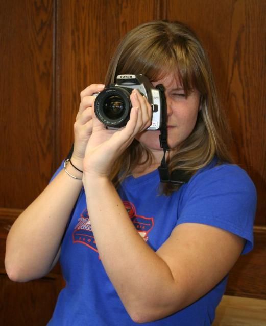 Figure 1. This woman is holding a camera correctly. Holding a camera correctly is the best way to get a sharp, clear picture.