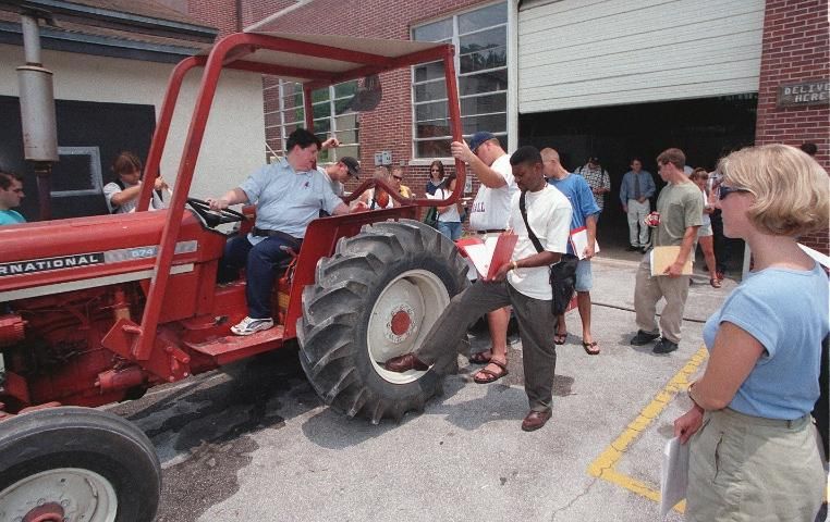 Figure 1. Participants learning farm machinery safety integrate agricultural and STEM learning in real-world context.