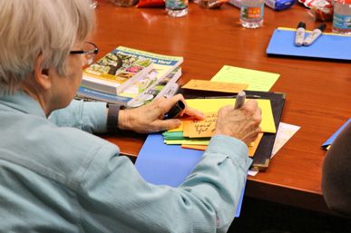 Figure 2. A participant fills out a data card during a journey-mapping session.